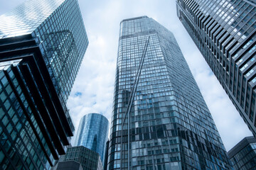 A modern corporate architecture composition in Frankfurt featuring a bold skyscraper that defines the finance district through stability, growth and future skyline progress