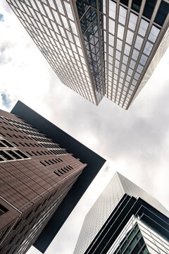 Modern Frankfurt architecture capturing a glass skyscraper rising from the finance district, conveying corporate identity tied to stability, growth and the future skyline