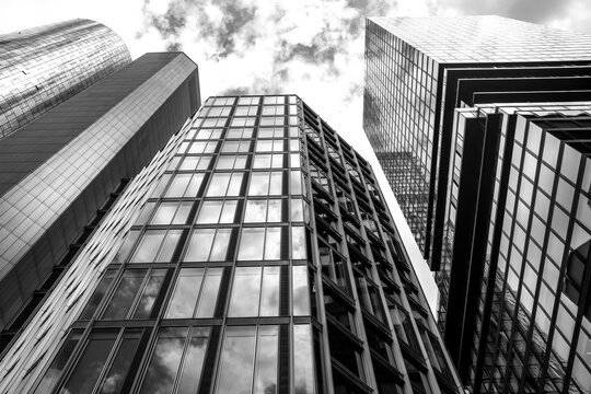 Corporate architecture within Frankfurt’s finance district centered on a prominent skyscraper, expressing a modern skyline shaped by stability, growth and future ambition