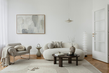 A serene living room with a neutral color palette, featuring a plush curved sofa, abstract artwork,...