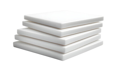Stack of five square white foam pads arranged neatly on a black background in a studio setting