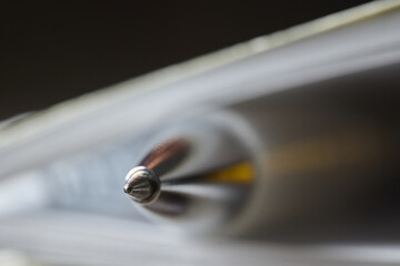 Close up view of a silver pen on a notebook