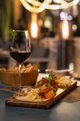 Cozy Dinner with red wine and cheese platter