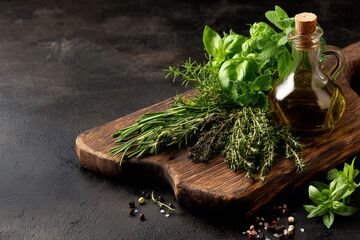 Fresh vibrant herbs and olive oil on rustic wood cutting board for gourmet cuisine and healthy cooking, perfect for culinary blog or restaurant design