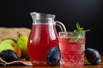 Obraz premium Natural refreshing compote of garden fruits and aromatic herbs