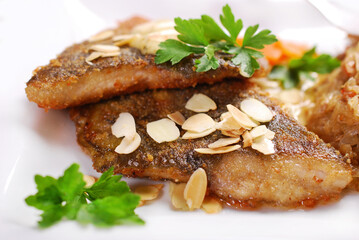 Carp fillets fried with almond flakes for Christmas