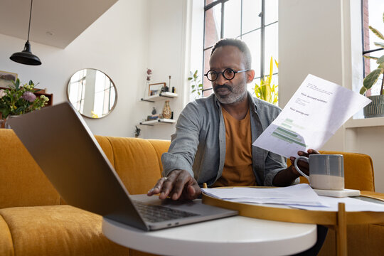 Mature man switching to green energy provider for his fuel and power