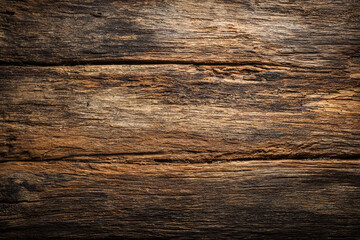 Fototapeta premium a weathered and textured old wood surface with visible grain and cracks