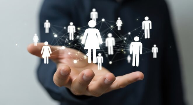 Digital network of white people icons floating above a businessman's hand, representing social connection, community, and human resources management in a futuristic interface