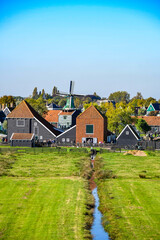 Perspective view of the Dutch polder landscape with drainage canal and traditional architecture
