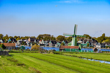 Busy summer day at the famous Zaanse Schans village, showcasing the landscape and visitors