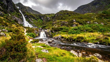 Scenic mountain landscape with waterfalls cascading into a rocky river