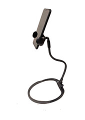 An isolated object on a white horizontal background. A mobile phone is on a special black stand.