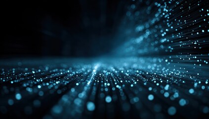 Abstract blue light trails and bokeh against a dark background.