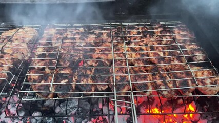 grilling chicken wings on a barbecue - Powered by Adobe