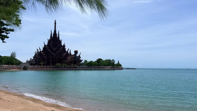Pattaya, Thailand, June 7, 2022: The Temple of Truth (Prasat Sut Jatum), a beautiful wooden Buddhist temple by the sea. The Temple of Truth in Pattaya. A giant wooden structure located on Naklua Cape.