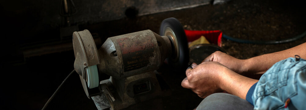 Banner Close up Mechanic man hands repairing car auto repair shop. Banner Man hands fixing machinery check vehicle mechanical motor service. Vehicle Car overhaul maintenance engineer with copy space