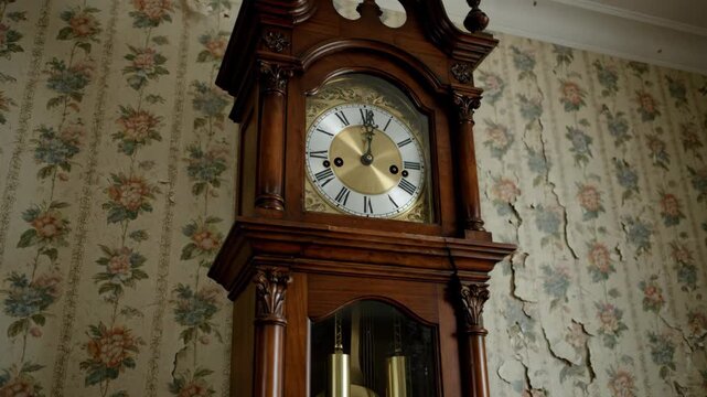 Vintage clock with floral wallpaper shows aging and disrepair