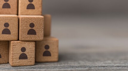 Organizing hr structure with wooden cubes and people icons in a professional environment