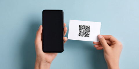 A person holding a smartphone and showing it to the camera, while also displaying a business card with a QR code on its surface