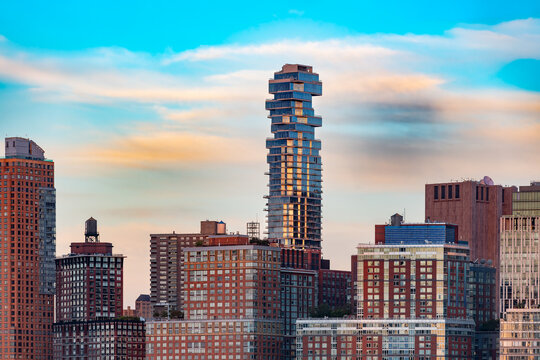 Luxury living is captured in this view of high rise apartment buildings dominating the Downtown Manhattan sky with massive scale and density, Tribeca, New York, United States