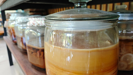 kombucha with layers in a large three-liter jar. organic healthy drink