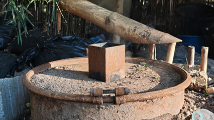 Smoke from the charcoal kiln chimney