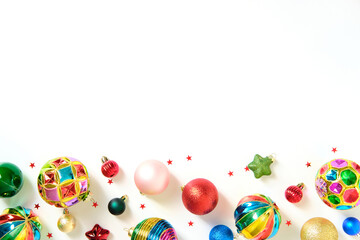 Vibrant Christmas ornaments bottom border on a white background.