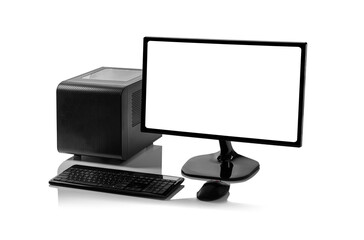 A black desktop computer setup, including a small form factor tower, a monitor with a blank white screen, a keyboard, and a mouse, is isolated on a white background with a reflective surface.