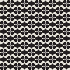 Flower shapes pattern vector background in black and white shades for wall décor, textiles, interior design and more.