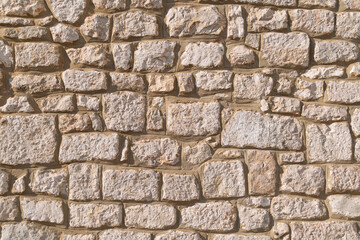Rustic stone wall with natural texture and irregular pattern