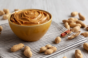 Fototapeta premium Creamy Brown Peanut Butter in a Bowl, low angle view.