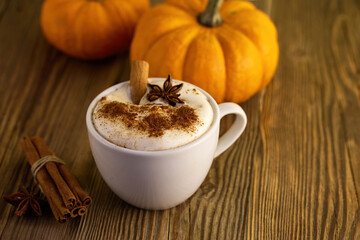 Autumn Pumpkin Spice Latte. A warm latte with cinnamon and star anise, surrounded by pumpkins