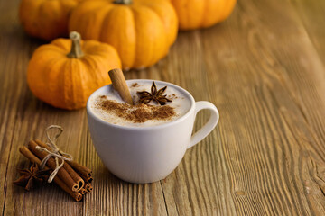 Autumn Pumpkin Spice Latte. A warm spiced latte with cinnamon and star anise, surrounded by pumpkins