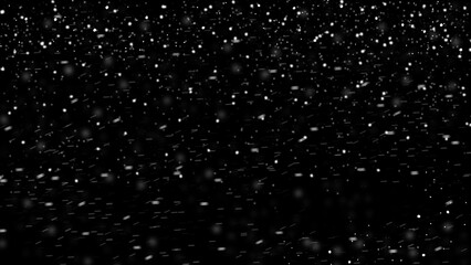 winter blurred snowflakes falling on black background