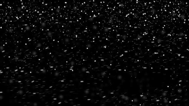 winter blurred snowflakes falling on black background