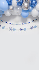 Festive winter backdrop with blue, white and silver balloons and central copy space.