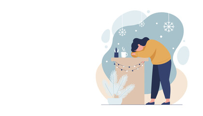 Stressed person resting head on a winter holiday table with coffee Seasonal depression or burnout concept