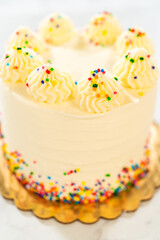 Vertical shot of tall frosted cake