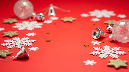 Christmas decoration background with snowflakes, star and bell on red surface