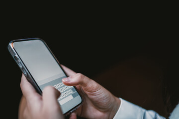 Young female holding smartphone, thumbs in motion over virtual keyboard, deep in text conversation, illustrating digital fluency and mobile-first habits.