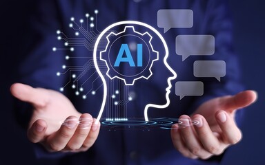 Artificial intelligence interface concept – person typing on laptop with glowing AI head silhouette and chat bubbles symbolizing digital innovation