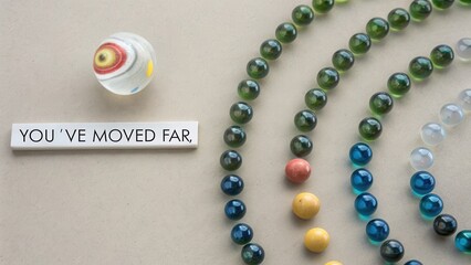 Spiral Arrangement of Colorful Glass Marbles Moving Forward