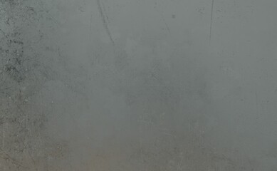 Close-up of a textured gray surface, showing clear signs of wear with scratches, scuffs, and subtle smudges. It evokes an aged, industrial, or metallic background