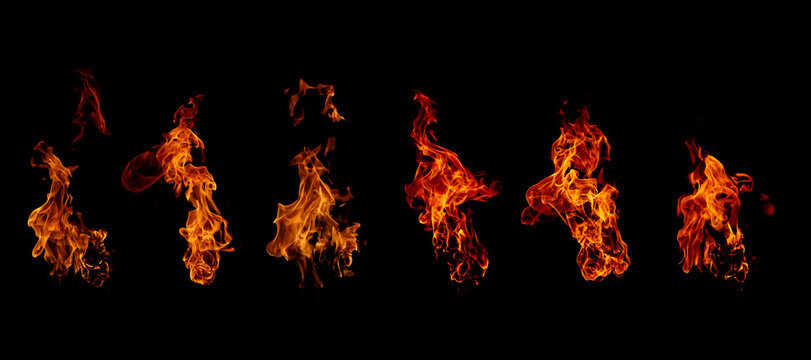 Dynamic isolated fire flames on a black background, showcasing vivid orange and red textures ideal for energy, heat, danger, and dramatic visual effects in creative design projects.