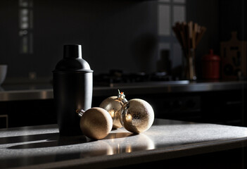 Cocktail shaker with golden ornaments on kitchen counter in evening light, Holiday Coctails