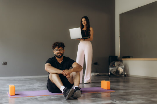 Man and woman learning fitness online