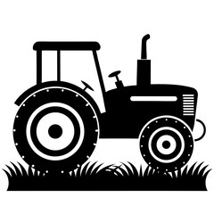 Classic farm tractor silhouette standing in grassy field