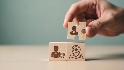 Matching talent to business needs hand placing puzzle piece with businessperson icon on wooden block representing human resources and recruitment