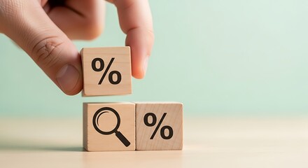Hand placing percentage symbol block on magnifying glass and percentage blocks for sale or discount research and analysis concept
